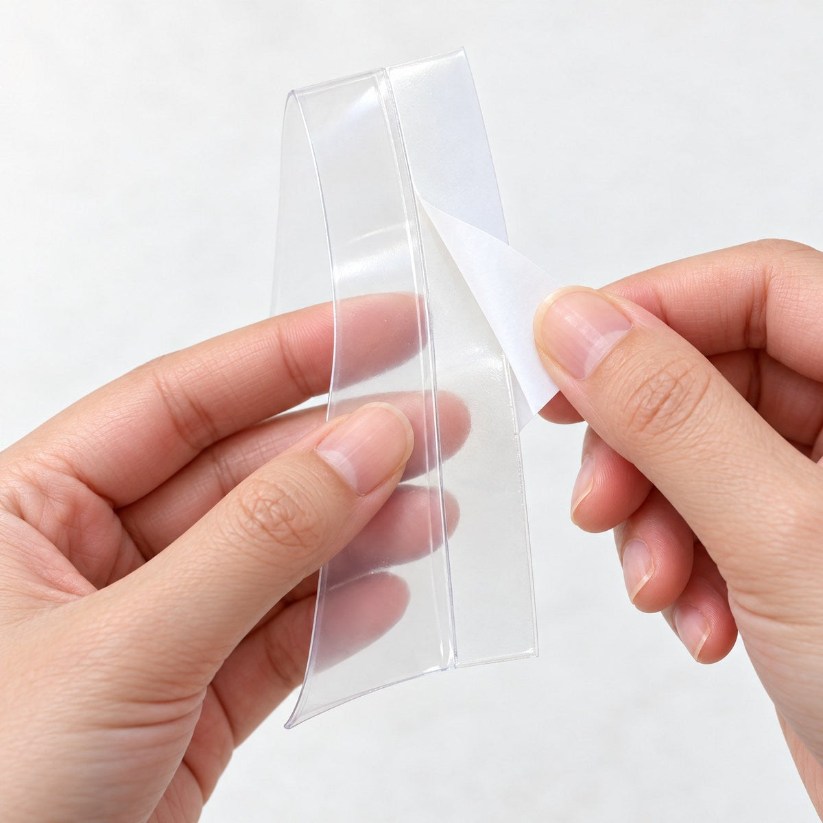 Peeling the backing off HeatSaver Door Seal